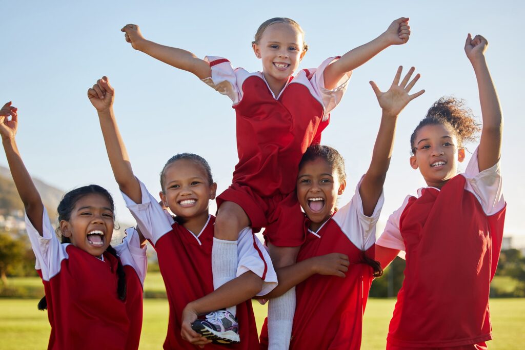 youth soccer team celebrating championship win