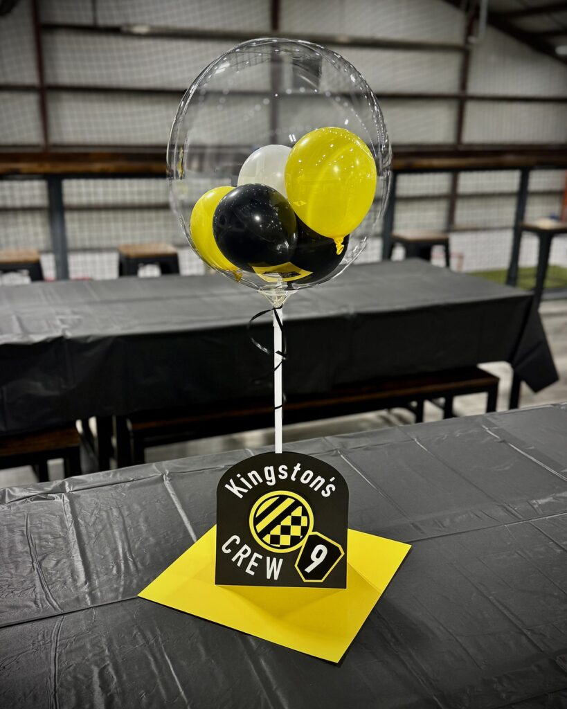 Custom Locker Soccer birthday party centerpiece featuring black and yellow colors, showcasing a fun and sporty design.