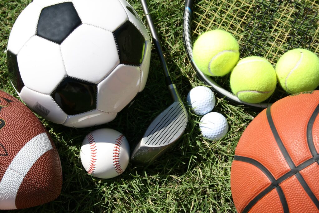 A collection of sports equipment representing different types of sports, emphasizing specialization in athletic training.