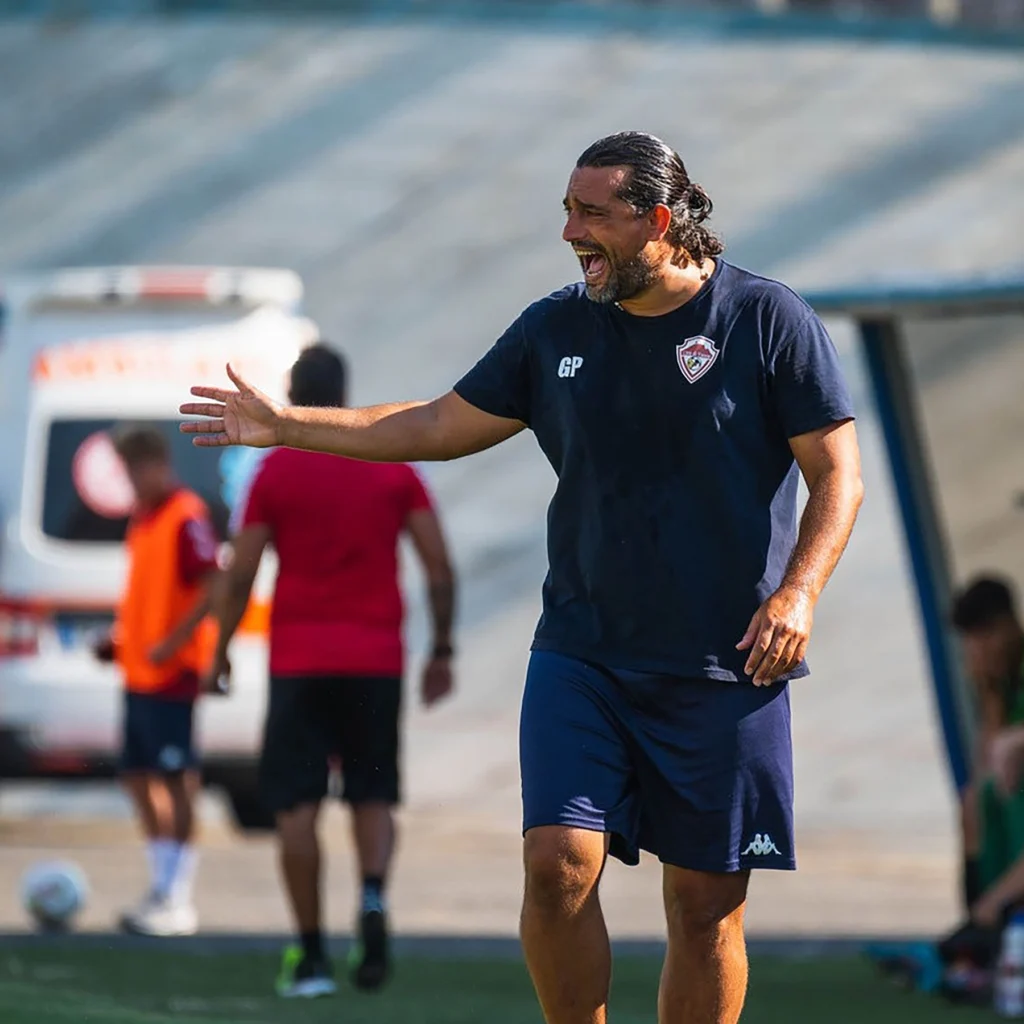 Gianluca Porro, professional soccer coach from Italy, coaching on the sidelines during a Locker Soccer Academy training session