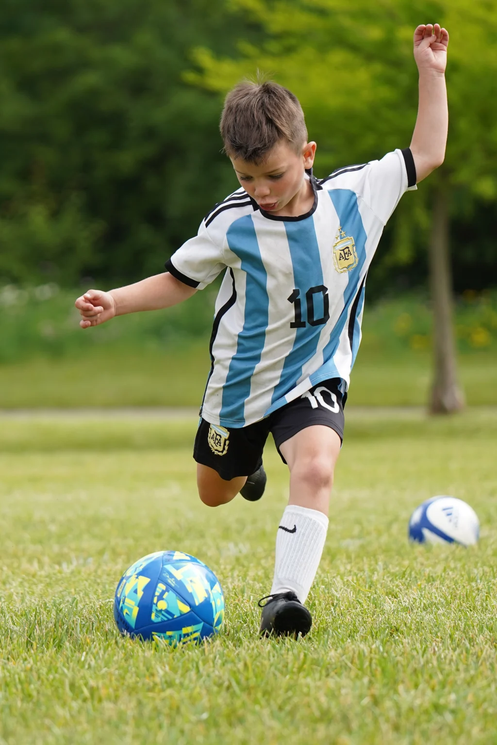 Focused youth player prepares to shoot the ball during Locker Soccer Academy Specialized Training Camp