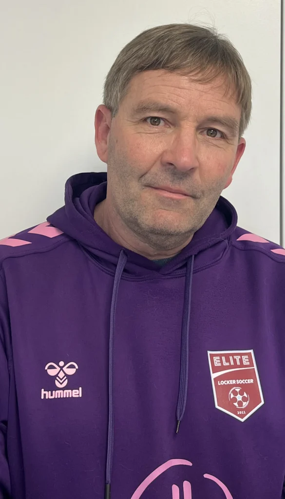 Coach Mike from Locker Soccer Academy smiling in a professional headshot photo.