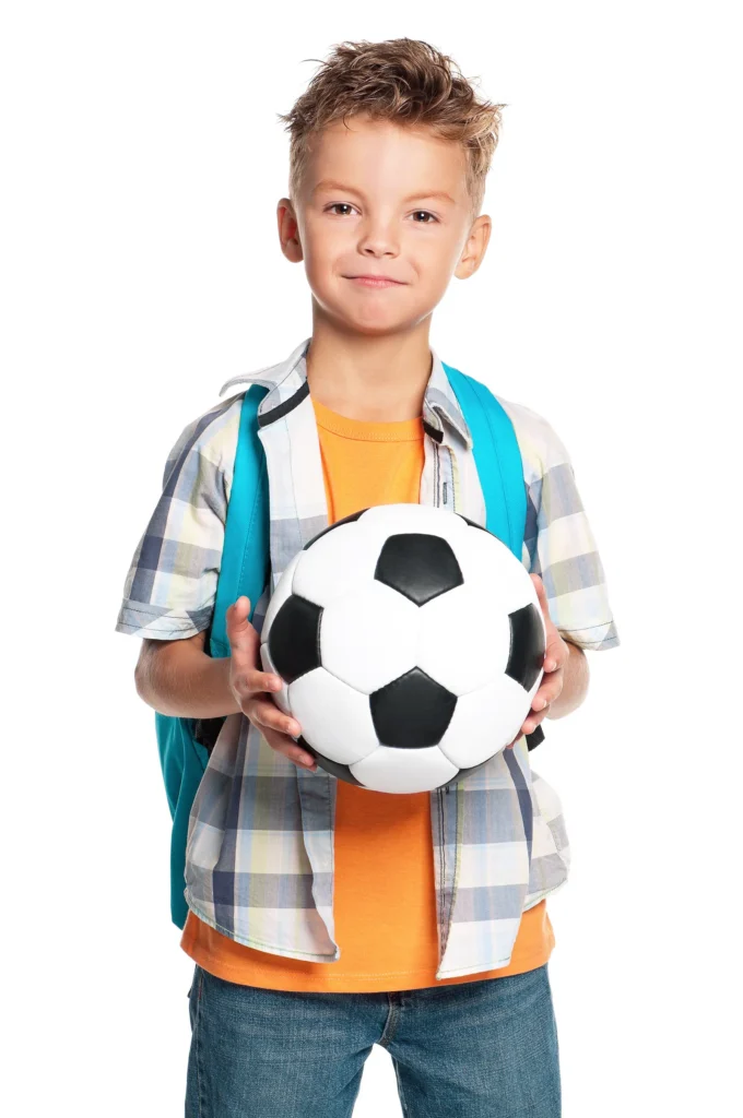 Young soccer player with a backpack and soccer ball ready for back-to-school and fall soccer registration in Columbus, Ohio.
